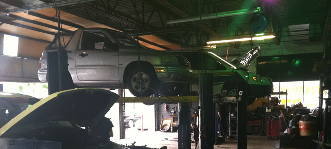 Car lifted in AMS' Transmission Repair Shop